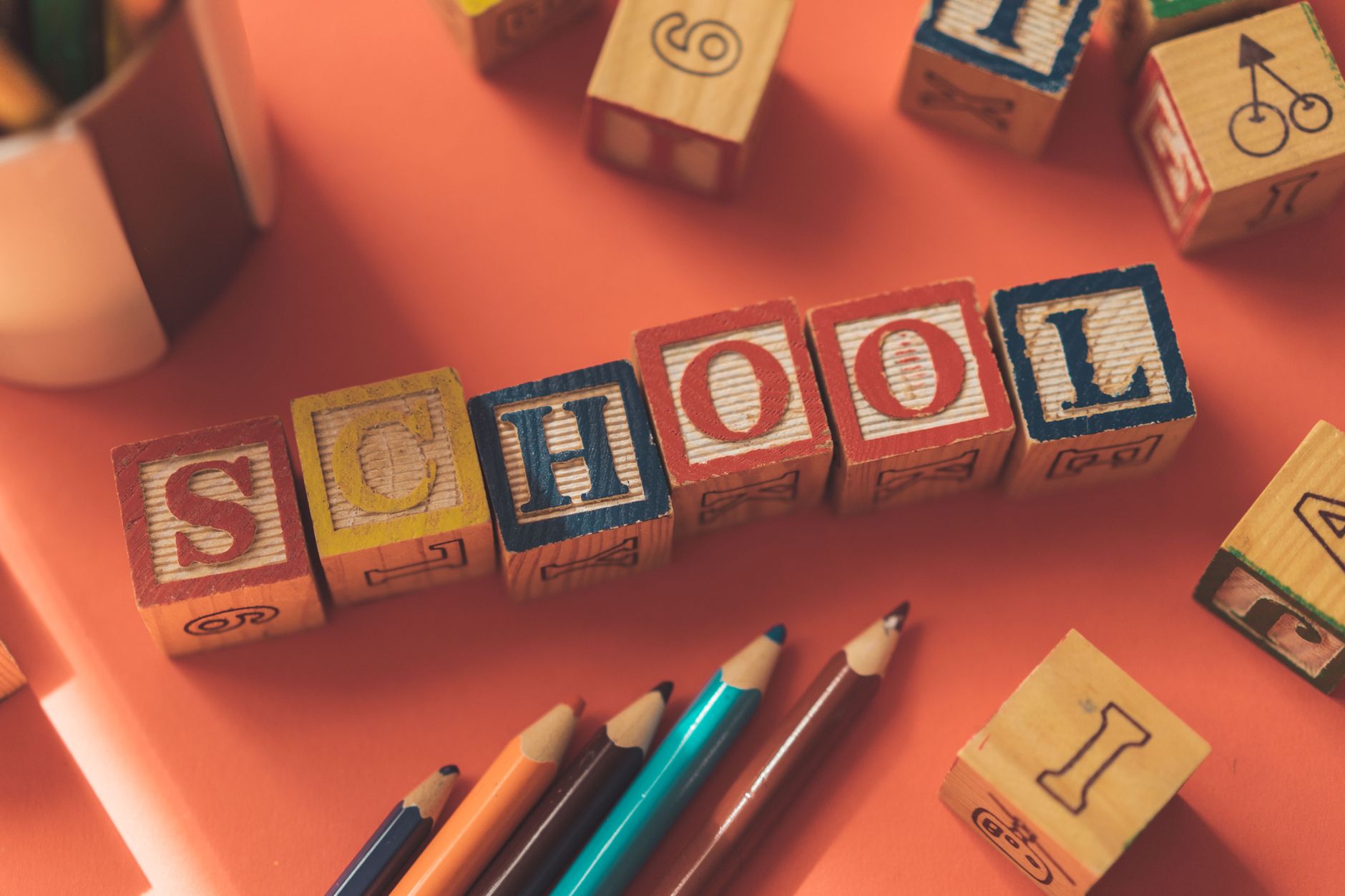 wooden cubes with letters and color pencils